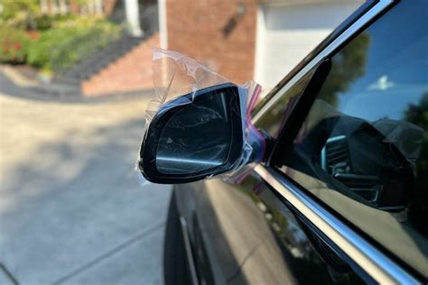 putting bags over mirrors on car